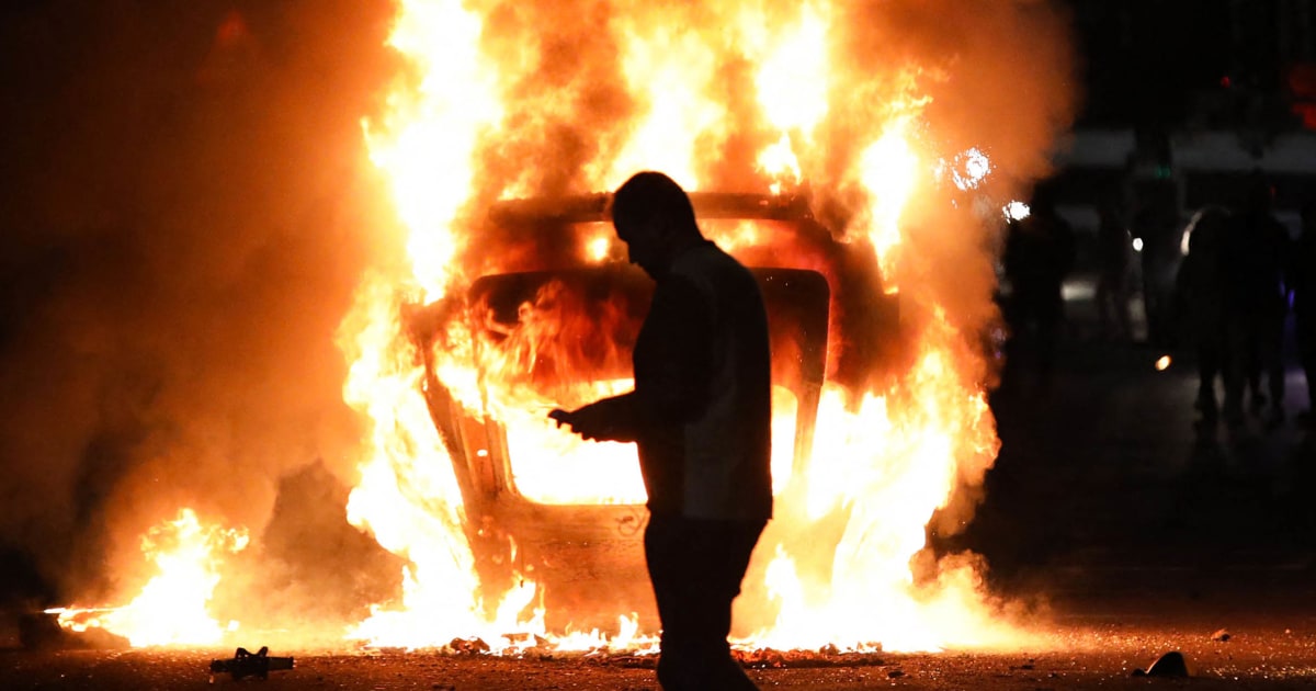 Rioters attack police and torch houses for a second night in Northern Ireland
